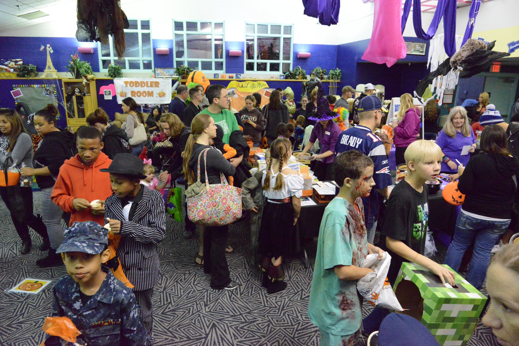Friday evening’s Bootastic fall carnival at the youth center was a success, with hundreds of children in costume. The carnival featured a haunted house, an obstacle course, a variety of games, dozens of vendors and “trunk-or-treat."  (Photo by Ken Moore)