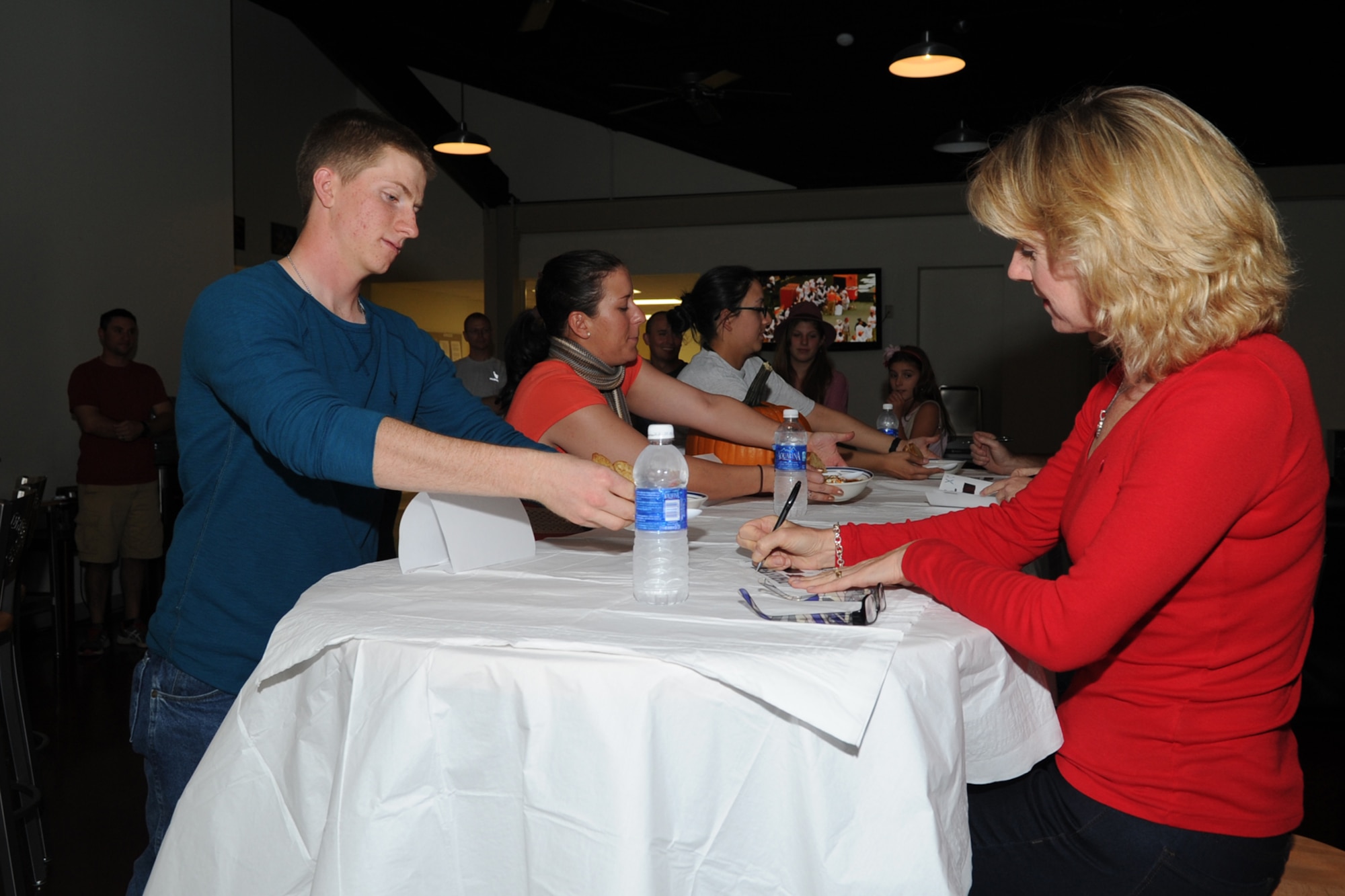 GOODFELLOW AIR FORCE, Texas -- Team Momma’s Home Cooking, comprised of 315th Training Squadron students, serves the appetizer course to the judges during Goodfellow's rendition of ‘Iron Chef’ at the Crossroads Student Center Oct. 26. The program was an opportunity for the chapel student leaders to develop leadership skills. (U.S. Air Force photo/ Staff Sgt. Laura R. McFarlane)