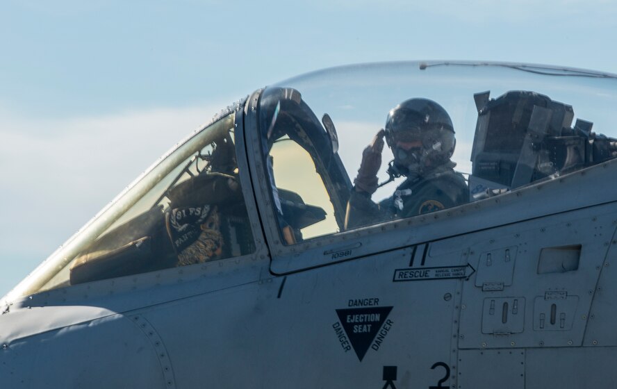 U.S. Air Force Lt. Col. Jeffrey Hogan returns a customary salute after being marshaled off the parking ramp at Moody Air Force Base, Ga., Oct. 23, 2013. Ground crew members salute to signify transfer of control over the aircraft to the pilot. (U.S. Air Force photo by Airman 1st Class Ryan Callaghan/Released)
