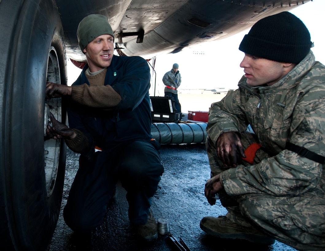 Senior Airman Cody Patterson, 28th Aircraft Maintenance Squadron crew chief, trains Airman 1st Class Oren Carr, 28th AMXS crew chief, on how to perform a brake replacement on a B-1 bomber at Ellsworth Air Force Base, S.D., Oct. 24, 2013. Ellsworth crew chiefs routinely check and maintain the brakes of all  B-1 bombers to ensure they are serviceable. (U.S. Air Force photo by Airman 1st Class Alystria Maurer/Released)