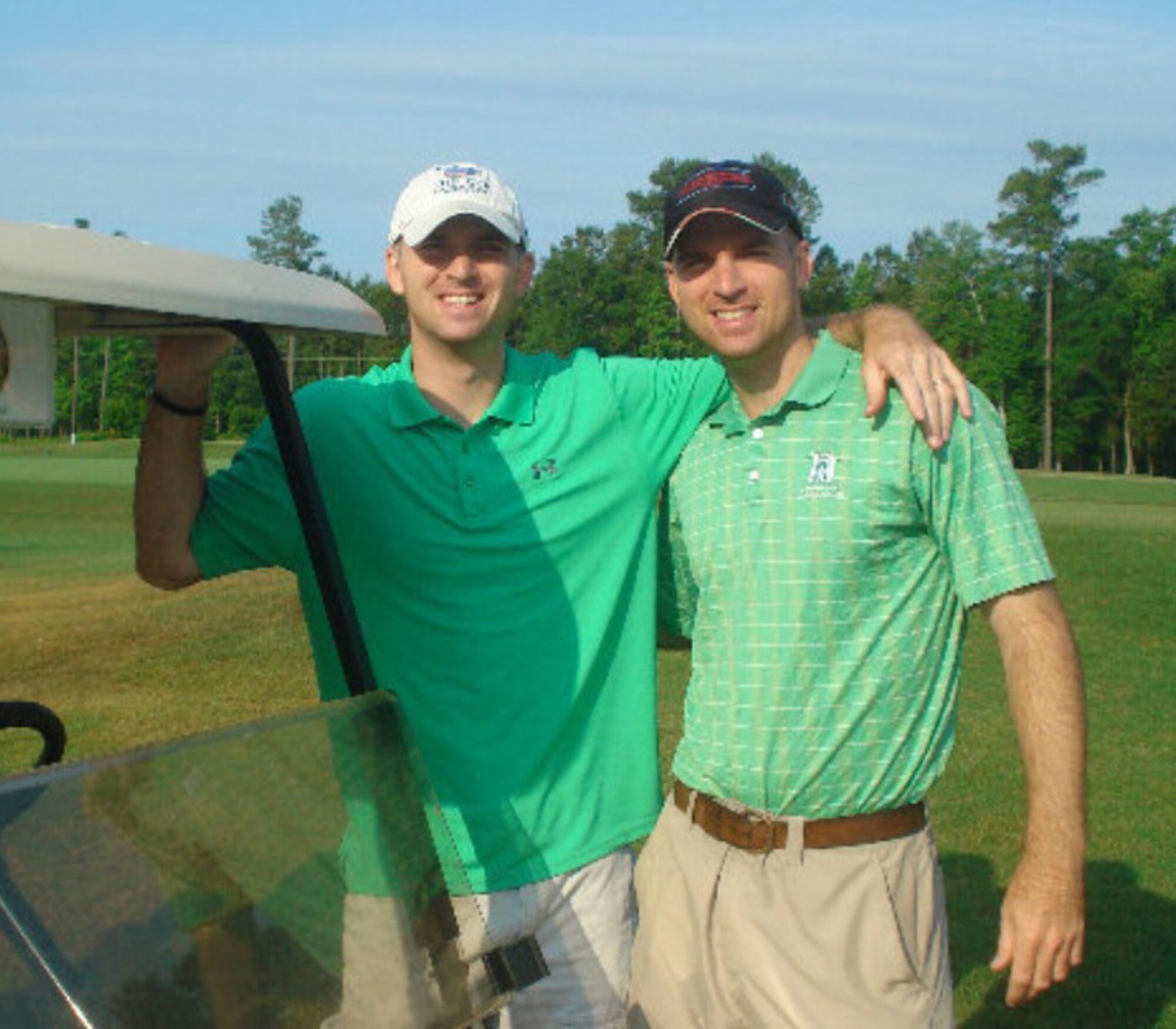 Maj. Macey Bozarth (left), Air Force Global Strike Command force management branch chief, cyber officer functional manager and communications directorate, and Maj. Cooper Bozarth, 96th Bomb Squadron radar navigator instructor, pose for a photo during a round of golf in 2012. Macey and Cooper joined the Air Force June 30, 1999 and received their commission through the Air Force Academy. (Courtesy photo)
