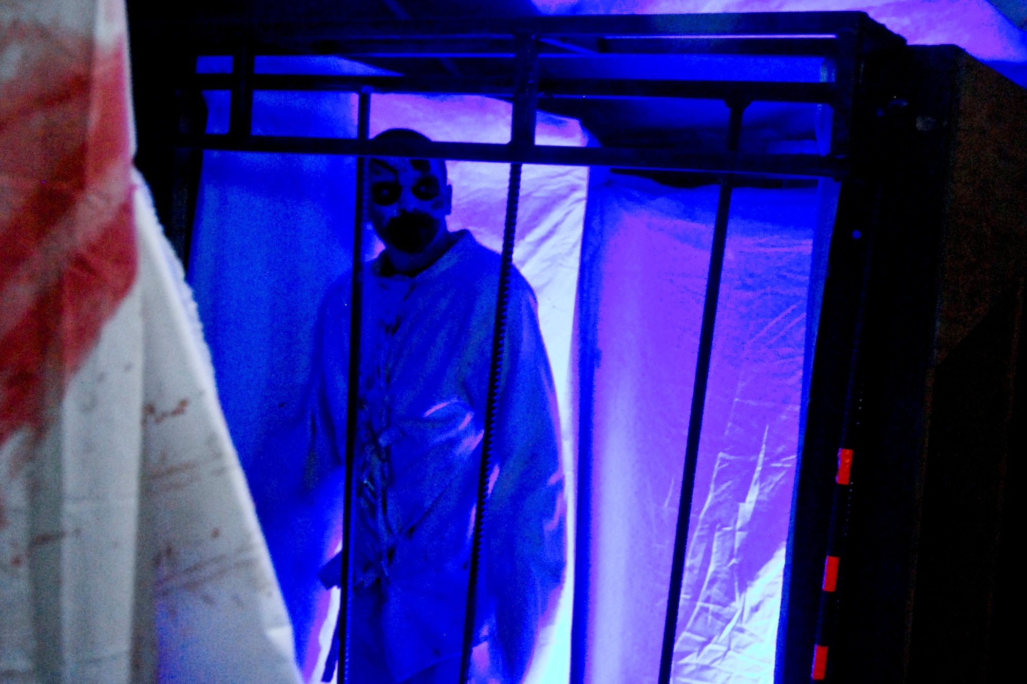 Airman 1st Class Luke Fyke, 355th Civil Engineering Squadron electrician, waits to scare people during Terror in the Corn" at Buckelew Farm in Tucson, Ariz., Oct. 25, 2013. Fyke was one of several Airmen to volunteer at the corn maze during the month of October to raise money for their squadron's booster club. (U.S. Air Force Photo by Staff Sgt. Angela Ruiz/Released)