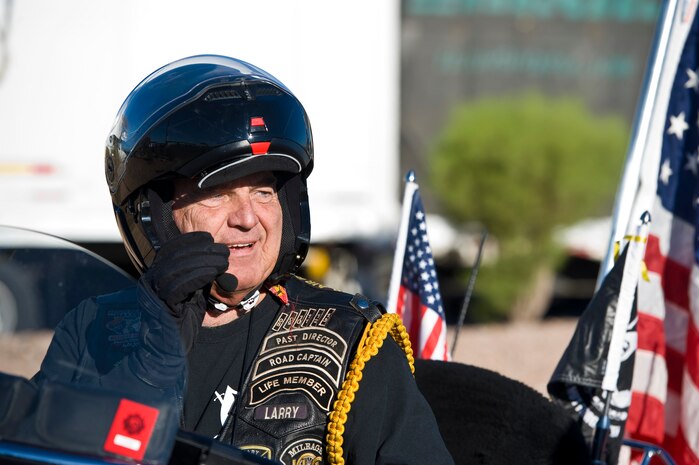 Larry Kusler, Nation of Patriots flag bearer, prepares to move an American flag to Nellis Air Force Base, Nev., during the Patriot Tour Oct. 26, 2013, in Las Vegas. Kusler is the regional commander for Nation of Patriots of the Arizona, Nevada, and southern California areas. (U.S. Air Force photo by Airman 1st Class Christopher Tam)