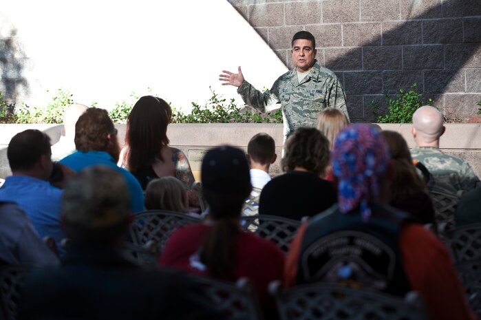 Col. (Dr.) Guillermo Tellez, 99th Medical Group commander, talks to members of The Nation of Patriots during The Patriot Tour at the Mike O'Callaghan Federal Medical Center Oct. 26, 2013, at Nellis Air Force Base, Nev.  The Nation of Patriots passes an American Flag throughout the country to honor and pay tribute to all past, present and fallen service members of America's Armed Forces every year. (U.S. Air Force photo by Staff Sgt. Christopher Hubenthal)