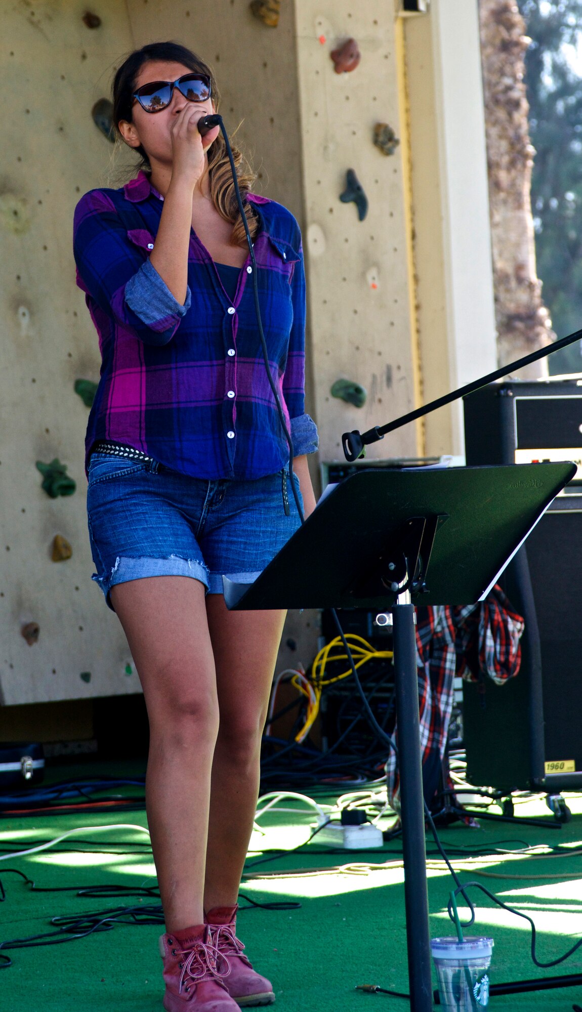 Muge Gerena, vocal performer, sings to attendants of the 2013 Fall Fest Oct. 26, 2013, at Incirlik Air Base, Turkey. Along with live music, the Fall Fest featured games, food, and activities for all ages. (U.S. Air Force photo by Staff Sgt. Eric Summers Jr./Released)