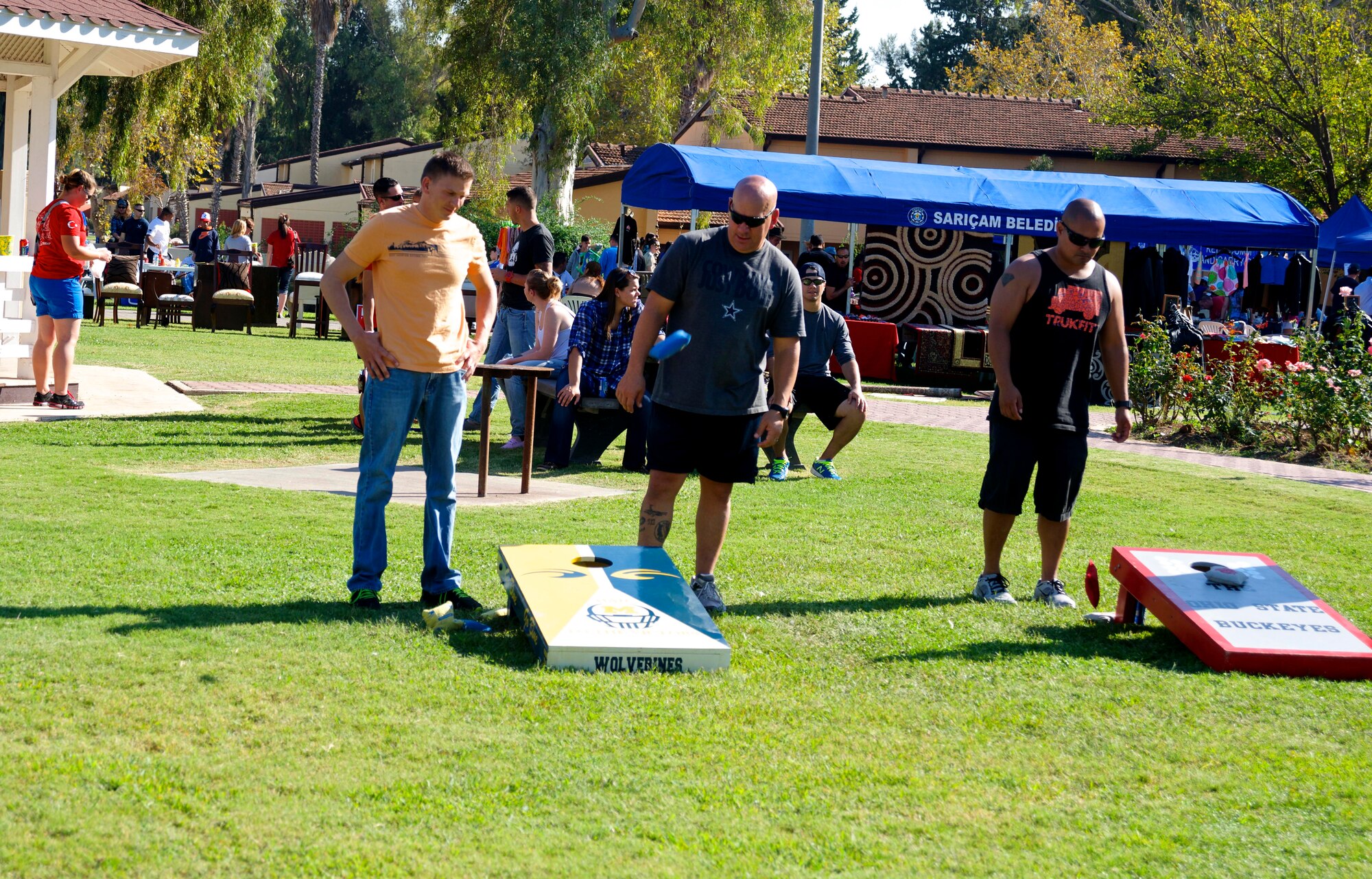 Members of Team Incirlik watch as a tossed bag falls towards the board during the corn-hole tournament Oct. 26, 2013, at Incirlik Air Base, Turkey. The corn-hole tournament was one of many events that took place during the festival. (U.S. Air Force photo by Staff Sgt. Eric Summers Jr./Released)