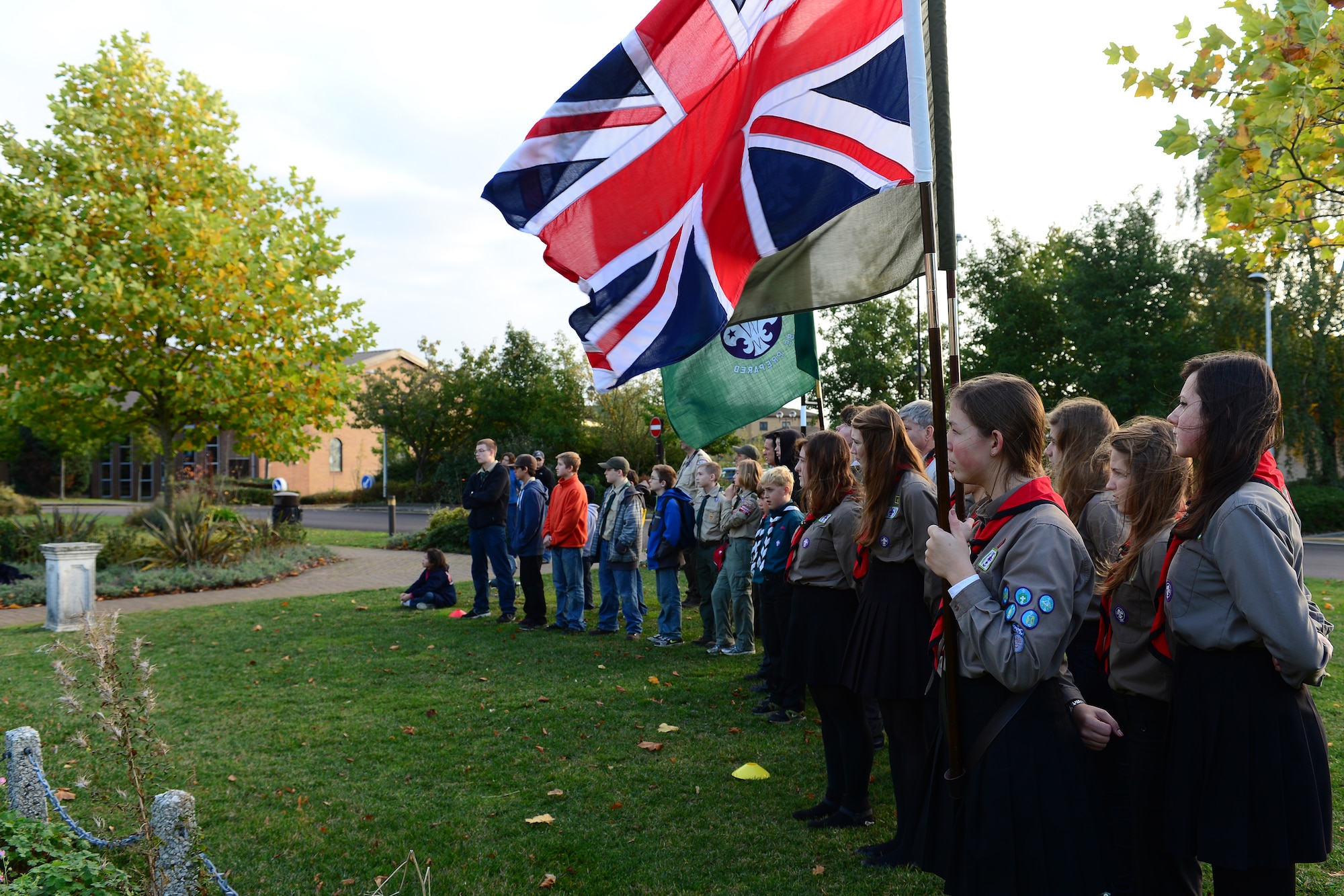 British and American scouts participate in the parade of flags opening ceremony during the Royal Air Force Lakenheath British-American Scout Campout Oct. 26, 2013. The weekend campout at RAF Lakenheath allowed U.S. and U.K. scouts to come together for an “American experience.” The campout highlighted some of the capablities of the U.S. Air Force here in the U.K., as well as gave the British Scouts an inside look of an American air base. (U.S. Air Force photo by Airman 1st Class Dana J. Butler/Released) 