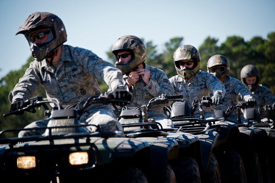 A row of Airmen prepare to enter the riding course during an ATV training class Oct. 25 at Eglin Air Force Base, Fla.  Approximately 20 Airmen from the 96th Security Forces Squadron and the 96th Ground Combat Training Squadron received the training over two days.  The new riders learned riding fundamentals and even some complicated techniques during the four-hour course. (U.S. Air Force photo/Samuel King Jr.)
