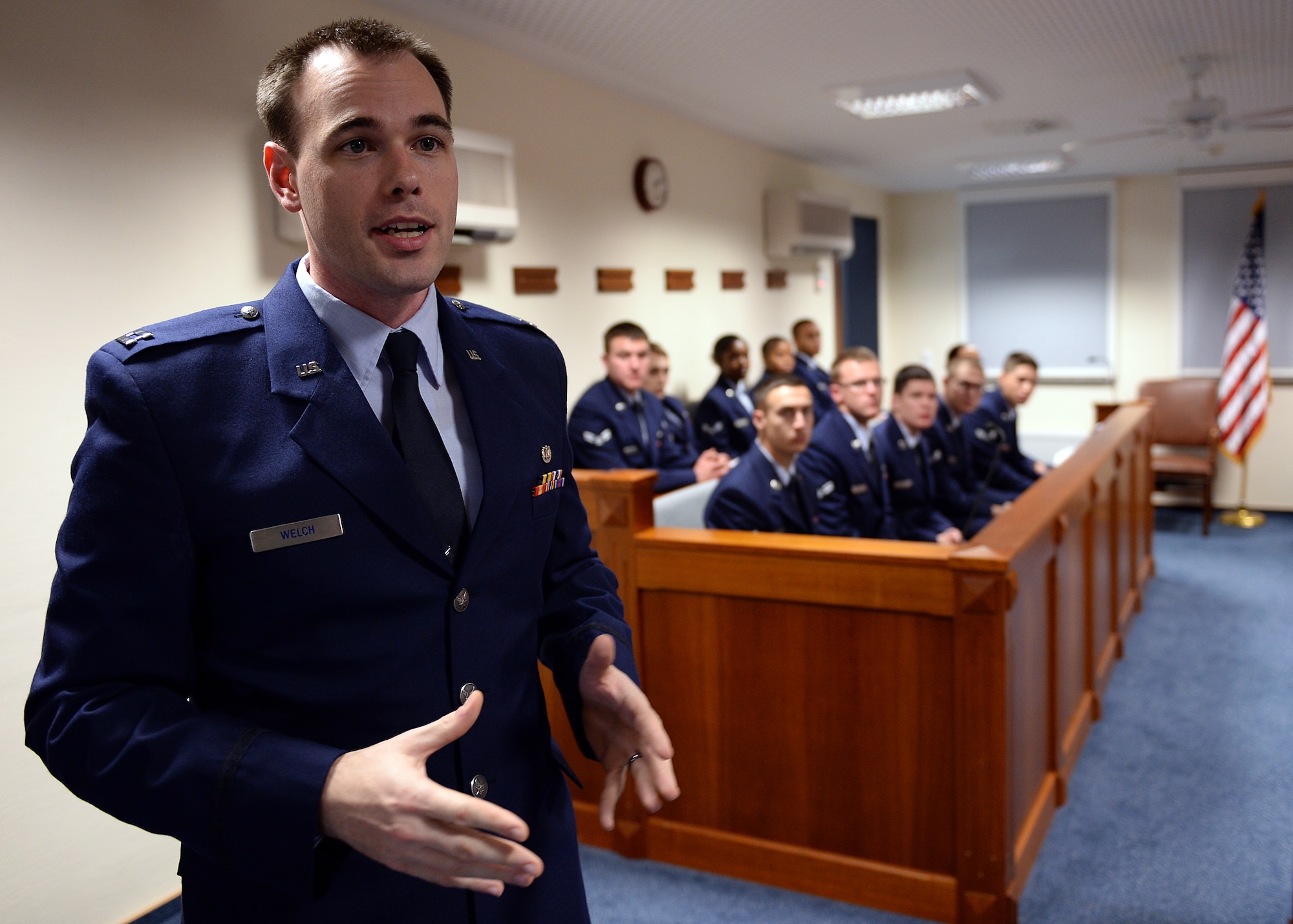 SPANGDAHLEM AIR BASE, Germany -- U.S. Air Force Capt. Samuel Welch, 52nd Fighter Wing Judge Advocate chief of military justice and from Fort Worth, Texas, explains the Air Force legal system while at the 52nd Fighter Wing legal office courtroom Oct. 24, 2013, to jury panel and audience members of Spangdahlem's interactive sexual assault prevention campaign, "Got Consent?" Many organizations throughout base collaborated in 2011 to create a process to educate new military members at Spangdahlem of the dangers of sexual assault. (U.S. Air Force photo by Staff Sgt. Daryl Knee/Released)