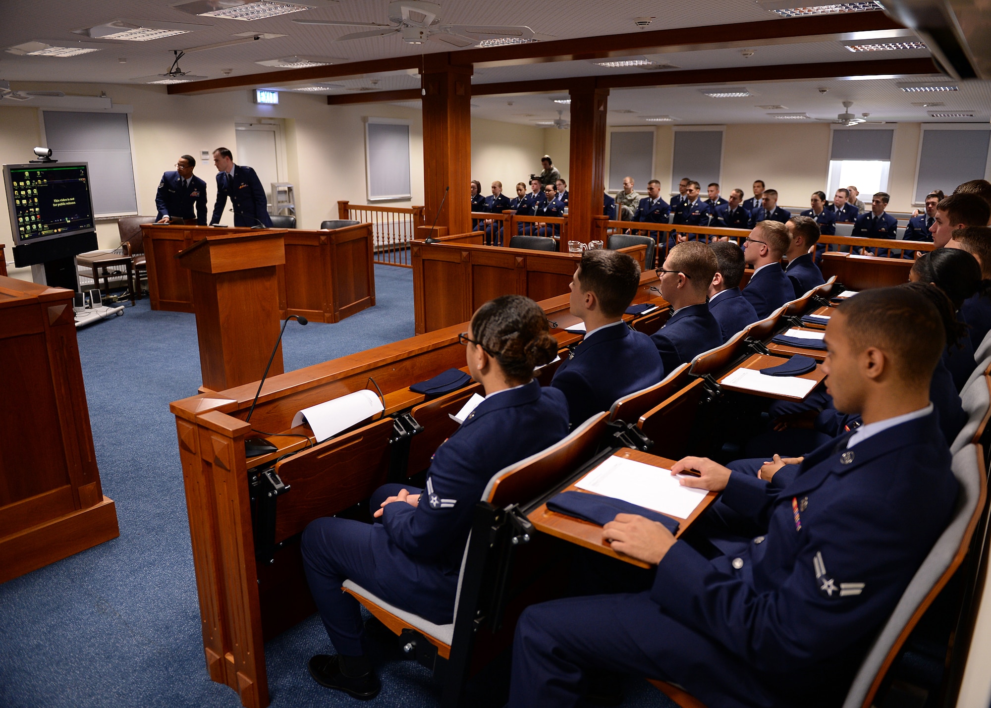 SPANGDAHLEM AIR BASE, Germany -- U.S. Air Force Airmen fill the 52nd Fighter Wing legal office courtroom during the "Got Consent?" training Oct. 24, 2013. "Got Consent?" is an interactive training session that allows first-term Airmen to participate as jurors in a sexual assault case. Legal office personnel broadcasted pre-recorded interviews from the plaintiff and defendant before the jury panel as part of the training’s program. (U.S. Air Force photo by Staff Sgt. Daryl Knee/Released)