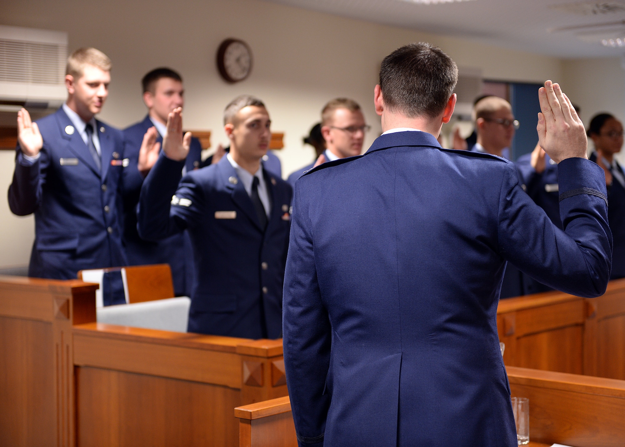 SPANGDAHLEM AIR BASE, Germany -- U.S. Air Force Capt. Samuel Welch, 52nd Fighter Wing Judge Advocate chief of military justice from Fort Worth, Texas, swears in jury panel members Oct. 24, 2013, at the 52nd Fighter Wing legal office courtroom during Spangdahlem's interactive sexual assault prevention campaign, "Got Consent?" Most Airmen on the panel completed less than one year of military service. The training provides an opportunity for first-term Airmen to learn about the legal process early in their careers. (U.S. Air Force photo by Staff Sgt. Daryl Knee/Released)