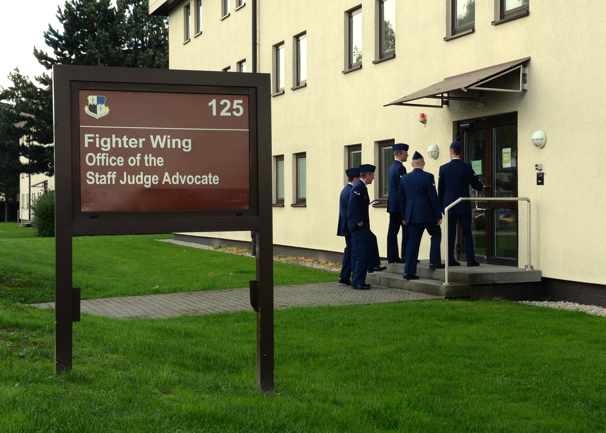 SPANGDAHLEM AIR BASE, Germany -- U.S. Air Force Airmen enter the 52nd Fighter Wing legal office Oct. 24, 2013, to partake in Spangdahlem's interactive sexual assault prevention campaign, "Got Consent?" First-term Airmen acted as jury panel members for a simulated trial as part of the training.  (U.S. Air Force photo by Staff Sgt. Daryl Knee/Released)