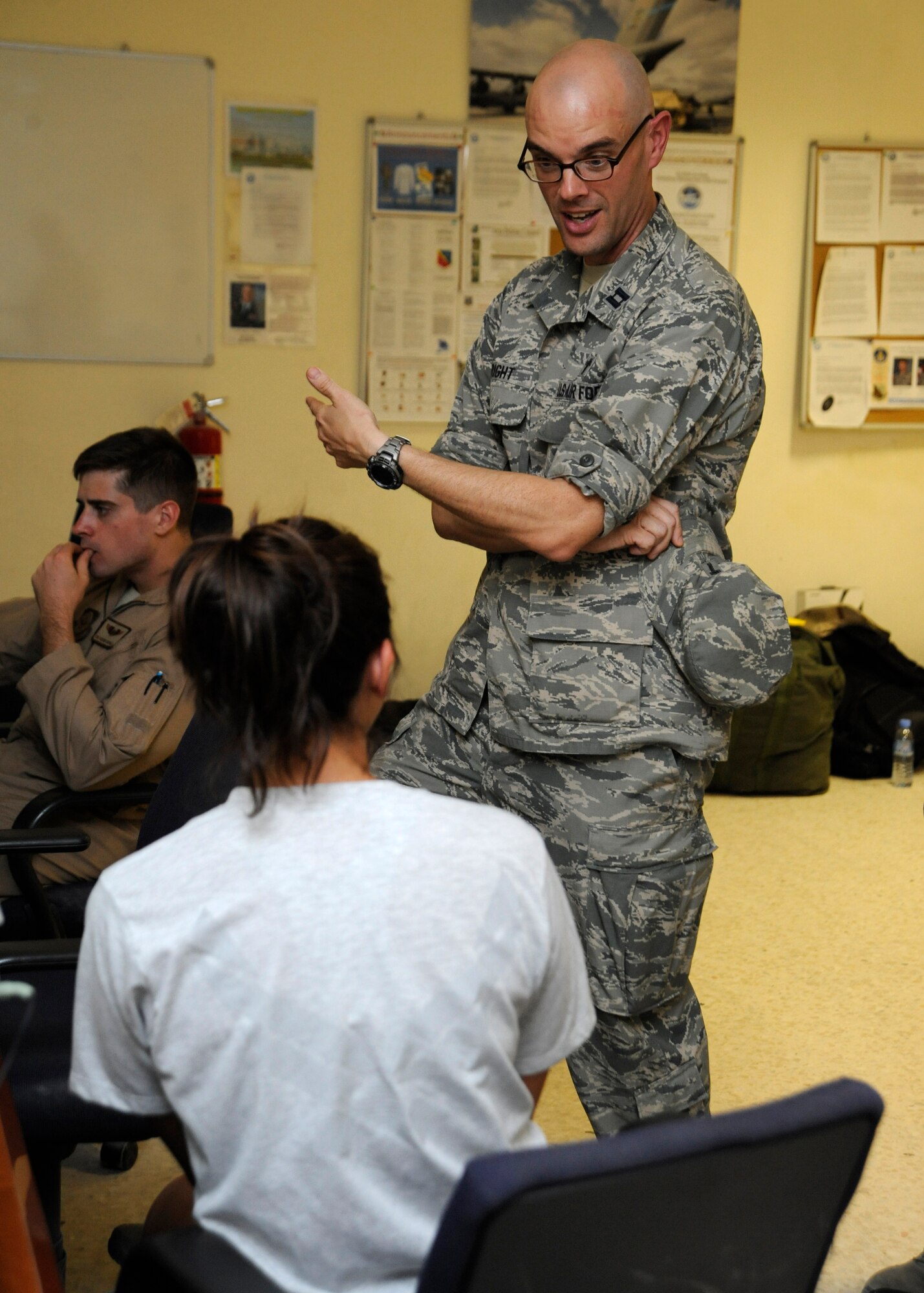 Chaplain (Capt.) Joseph Wright, IV, speaks to Capt. Natasha Blankenship during a visit at the 379th Air Expeditionary Wing in Southwest Asia, Oct. 22, 2013. Wright, along with his chaplain assistant is assigned to the 379th Expeditionary Operations Group, and as a religious support team they visit the assigned service members at their work centers. Wright is a 379th AEW protestant chaplain deployed from Eglin Air Force Base, Fla., and an Anderson, S.C., native. Blankenship is an 816th Expeditionary Airlift Squadron C-17 pilot deployed from Joint Base Charleston, S.C., and hails from Tampa, Fla. (U.S. Air Force photo/Senior Airman Bahja J. Jones) 