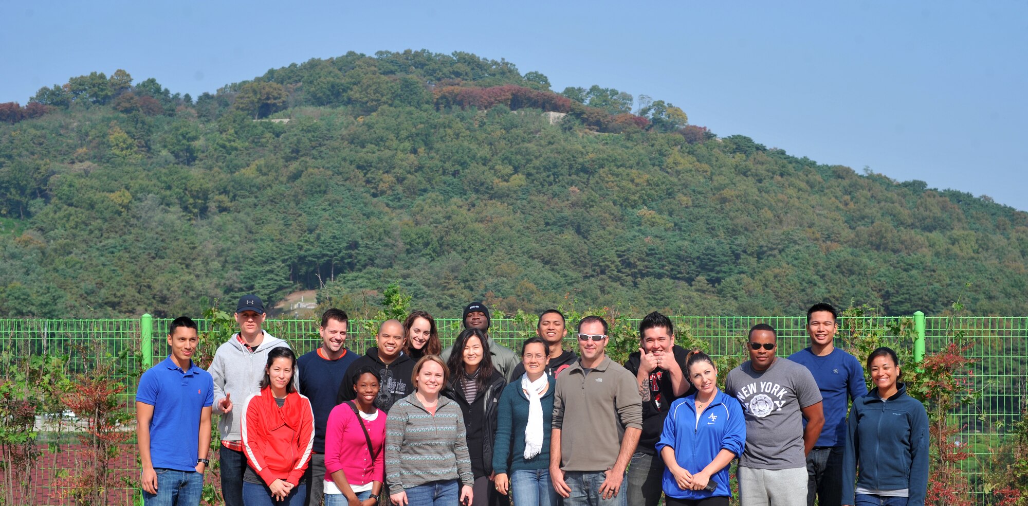 Volunteers pose for a group photo after a visit to the Seongsimdongwon Group Home for the disabled in Osan City, Republic of Korea, Oct. 27, 2013. The 18 volunteers brought Halloween candy and shared smiles with the disabled residents and students with special needs as a way to give back to the community. (Courtesy Photo)