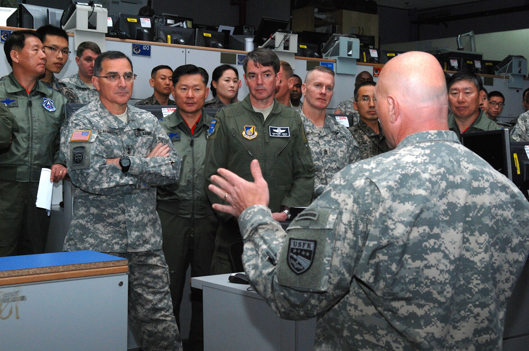 OSAN AIR BASE, Republic of Korea - Army Gen. Curtis Scaparrotti, commander of United Nations Command, Combined Forces Command and U.S. Forces Korea, receives a briefing from Army Col. Joseph Gleichenhaus, 3rd Battlefield Coordination Detachment - Korea commander, during a familiarization visit to 7th Air Force and Osan Air Base Oct. 30. During his visit Scaparrotti was shown how elements from every U.S. service branch worked alongside Republic of Korea military units to ensure peace and stability on the Korean Peninsula. (U.S. Air Force photo by Tech. Sgt. Thomas J. Doscher)