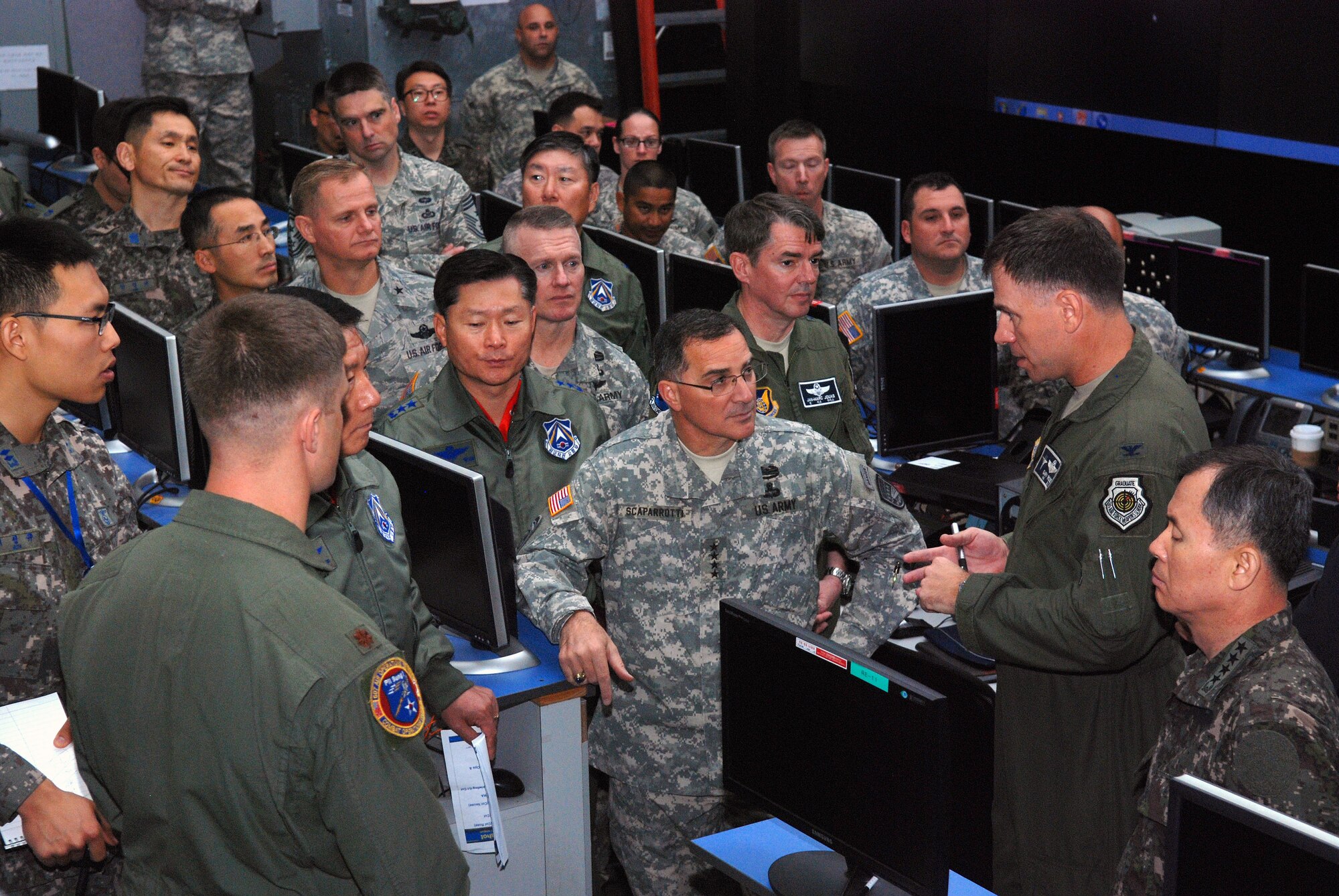 OSAN AIR BASE, Republic of Korea - Army Gen. Curtis Scaparrotti, commander of United Nations Command, Combined Forces Command and U.S. Forces Korea, receives a briefing from Air Force Col. Gary Rose, 607th Air and Space Operations Center Chief of Combat Operations, during a familiarization visit to 7th Air Force and Osan Air Base Oct. 30. During his visit Scaparrotti was briefed on 7 AF and 607th AOC capabilities and how air power is used to maintain peace and stability on the Korean Peninsula. (U.S. Air Force photo by Tech. Sgt. Thomas J. Doscher)