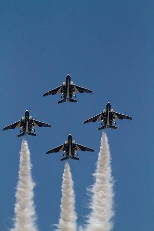 Blue Impulse planes fly over Marine Corps Air Station Iwakuni while performing aerobatic stunts during Friendship Day here, May 5, 2012. The events for the day also included static displays, bouncy houses and other attractions for children and a plethora of booths placed around the airfield.