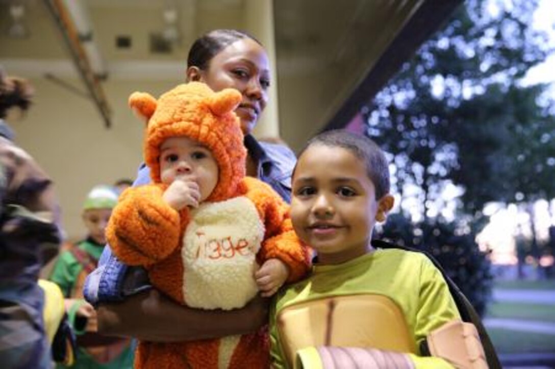 Sharona Russell enjoys the Center for Naval Aviation Technical Training Halloween party with her children Oct. 25 aboard the air station. Keep your children close while out trick-or-treating or enjoying Halloween festivities at the air station today.


