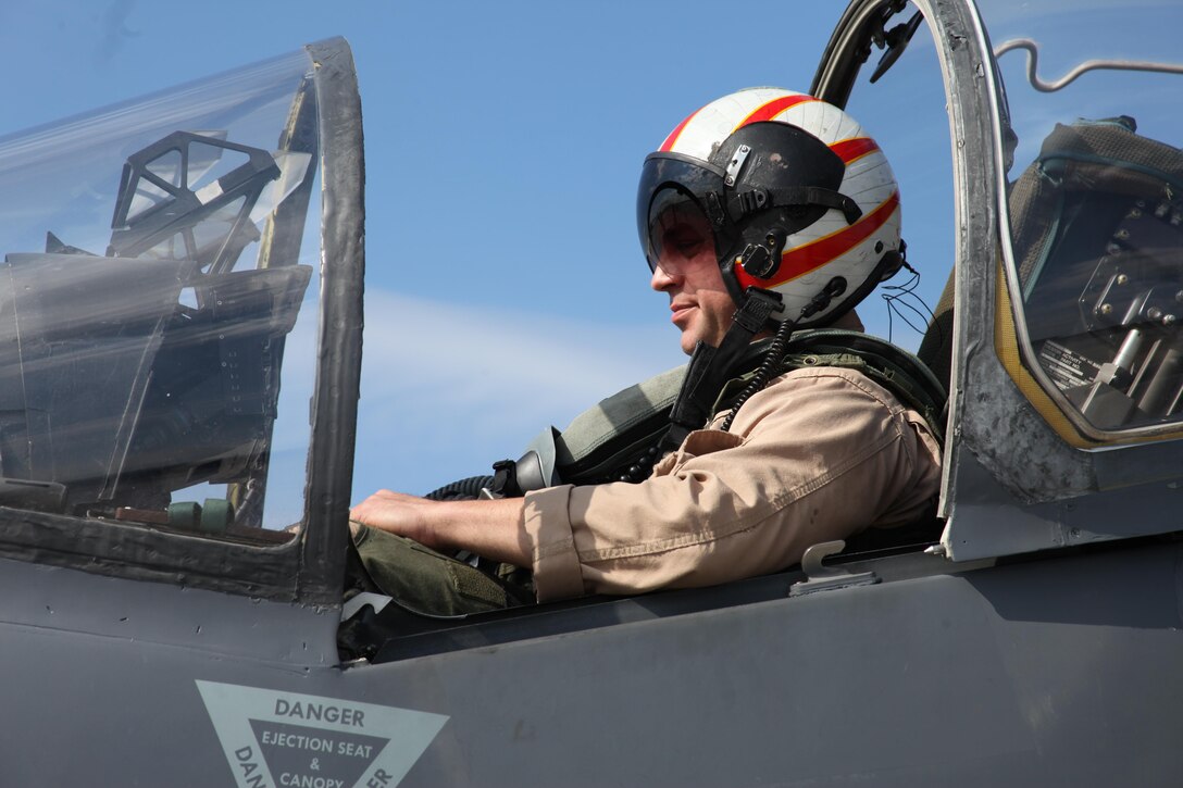 Capt. Travis M. Morris, checks his gear before departing from Marine Attack Squadron 223 Oct. 26, to conduct training aboard the USS Bataan in support of the 22nd Marine Expeditionary Unit. Morris is an AV-8B Harrier pilot with VMA-223. The squadron plans to provide fixed wing tactical air assets for the MEU's commander and augment the Air Combat Element with mission-essential tasks such as armed reconnaissance.