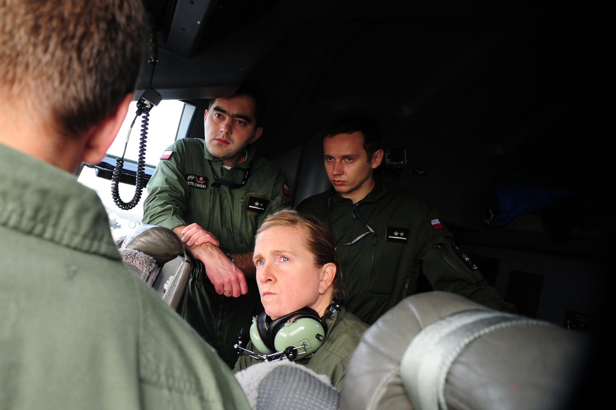 Pilots from the Polish air force and Airmen from the 37th Airlift Squadron go through a pre-flight brief during a theater security cooperation event, Oct. 21, 2013, Powidz Air Transport Base, Poland. Airmen from Ramstein Air Base, Germany got a unique opportunity to work hand-in-hand with their Polish counterparts. 