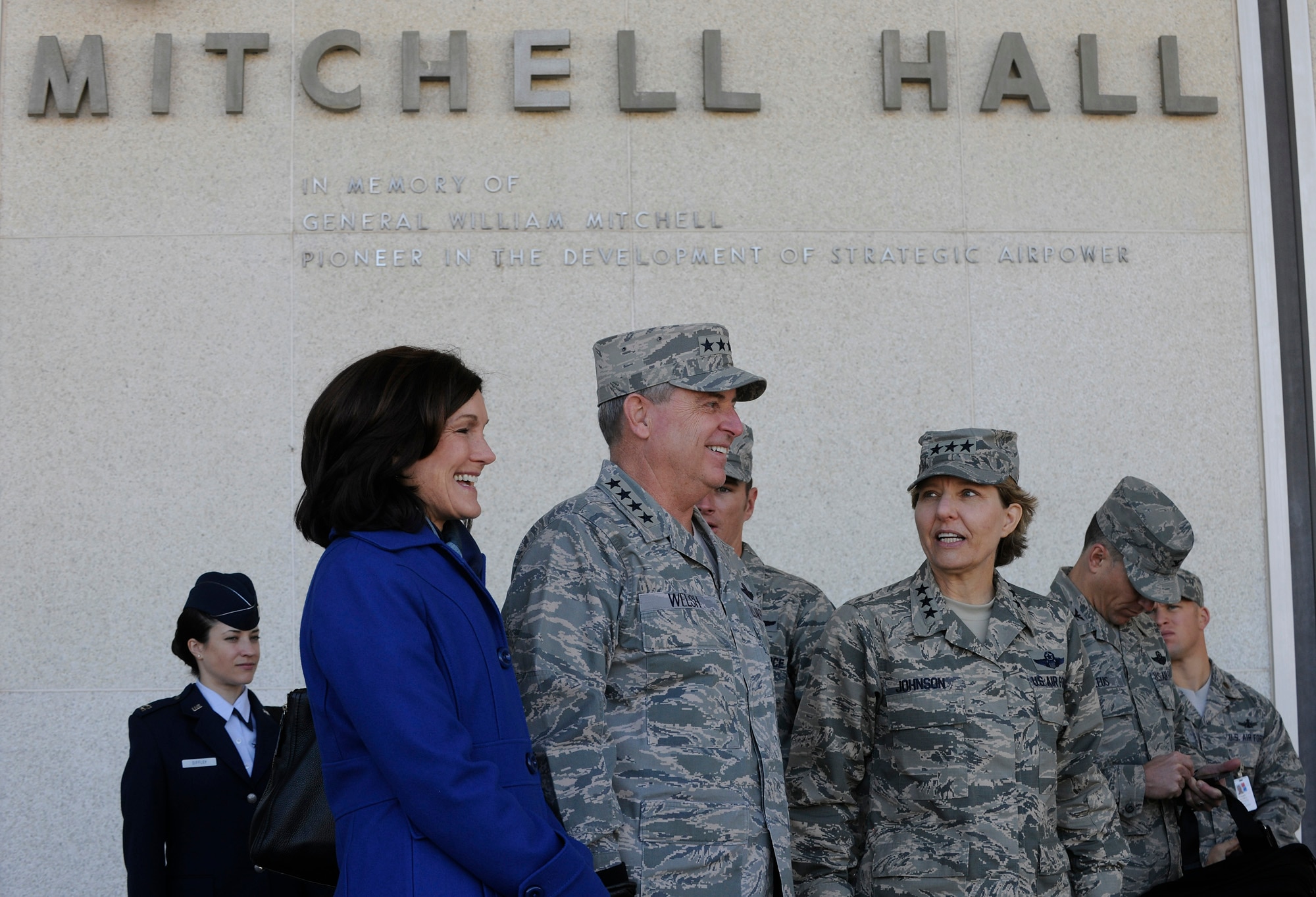 Air Force Chief of Staff Gen. Mark A. Welsh III, his wife, Betty, and Lt. Gen. Michelle Johnson, U.S. Air Force Academy superintendent, stand outside Mitchell Hall to observe cadet formation Oct. 28, 2013, Colorado Springs, Colo. Welsh, along with Chief Master Sgt. of the Air Force James A. Cody, visited with cadets Oct. 28 and 29 prior to participating in Air Force senior leader meetings the remainder of the week. In addition to hosting a cadet call, Welsh met with cadets over lunch and during several classroom visits and teamed with Cody to answer questions during “Stars and Chevrons,” a show on the cadet-run radio station, KAFA 97.7 FM.