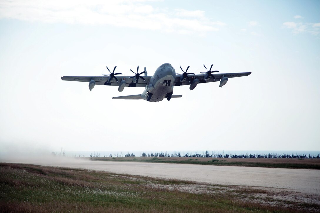 A KC-130J Hercules transport aircraft with Marine Aerial Refueler Transport Squadron 152 executes a touch-and-go landing Oct. 29 on a reconditioned runway at the Ie Shima Training Facility. The newly-reconstructed coral runway is designed for KC-130J aircraft. VMGR-152 is a part of Marine Aircraft Group 36, 1st Marine Aircraft Wing, III Marine Expeditionary Force. (U.S. Marine Corps photo by Lance Cpl. Natalie M. Rostran/Released)