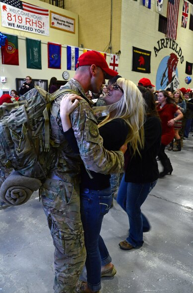 A young girl waits for a loved one to return to Malmstrom Air Force Base from their deployment Oct. 24. One hundred and seventy Airmen from the 819th and 219th RED HORSE Squadrons returned from their seven-month absence. (U.S. Air Force photo/Staff Sgt. R.J. Biermann)