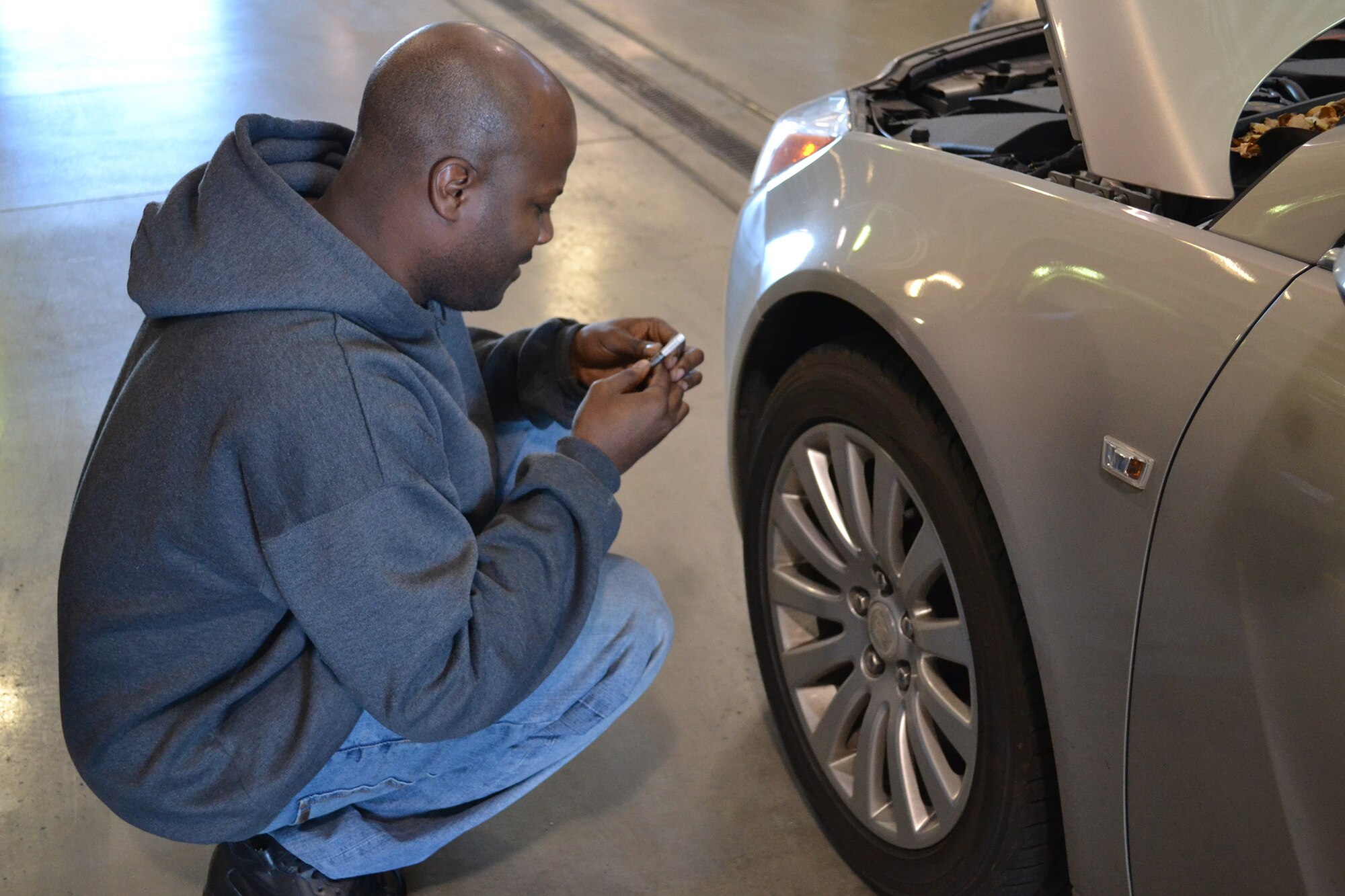 Staff Sgt. Reggie Manning, 341st Logistics Readiness Squadron material controller, checks the tread of a tire on a personally owned vehicle during the free winter vehicle inspections Oct. 26.  More free vehicle inspection will be conducted to Malmstrom Air Force Base members Nov. 2 and 3 from 10 a.m. to 2 p.m. at Bldg. 870.  (U.S. Air Force photo/Senior Airman Cortney Paxton)