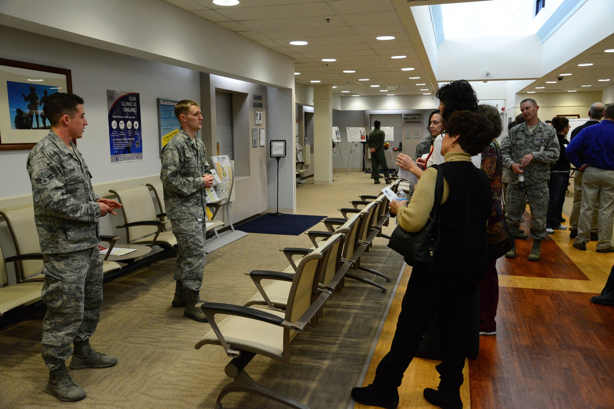 Capt. James Hougas, 341st Medical Operations Squadron family medicine physician (center), and Airman 1st Class Cavan Quam, 341st MDOS medical technician, explain the operations of the Family Practice section of the clinic to Great Falls health care professionals. During the tour, participants were shown the facility in detail and had the chance to see how Malmstrom’s medical center differs from civilian-based health care. (U.S. Air Force photo/Airman 1st Class Collin Schmidt)