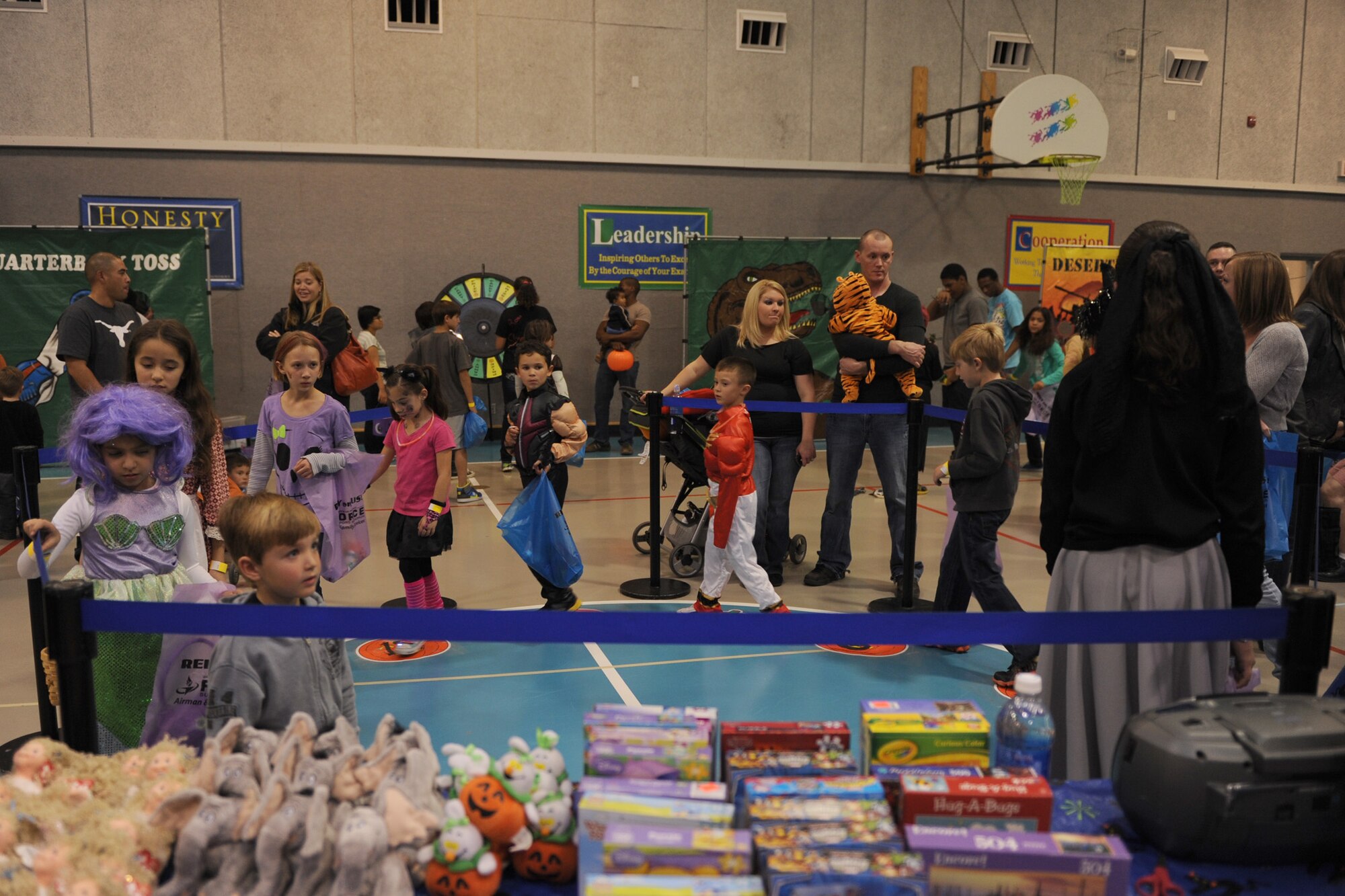 Children walk in a circle while playing musical pumpkins for a chance to win a prize at the fall festival on Oct. 25. Team Malmstrom members and their families attended the event in their favorite costume and played games during the annual Halloween celebration for children of all ages. (U.S. Air Force photo/Senior Airman Katrina Heikkinen)