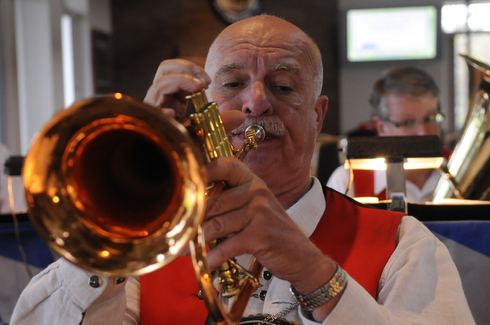 Gary Richmond, member of Festhaus-Musikanten, plays the French horn during the 2nd Annual Oktoberfest at Whiteman Air Force Base, Mo., Oct. 18, 2013. Oktoberfest included hay rides, pretzel eating contest, costume contest and hammer schlagen game. (U.S. Air Force photo by Staff Sgt. Alexandra M. Boutte/Released)