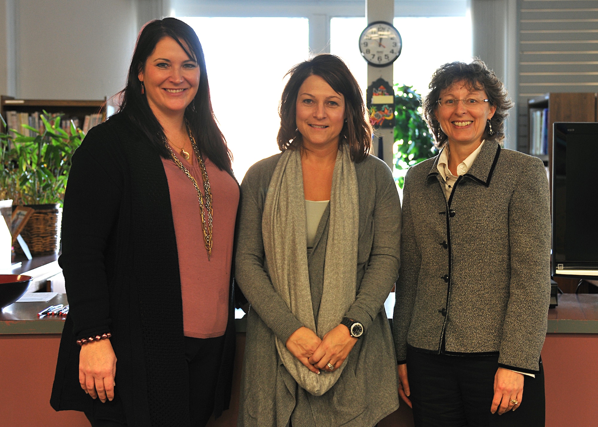 From right: Sarah Shimek, Grand Forks Public School District; Susan Spivey, Lutheran Social Services; and Kelly Painter, school liaison officer, pose for a photo at the Airman & Family Readiness Center after teaching a Bullying Prevention Training class, held Oct. 29, 2013, on Grand Forks Air Force Base, N.D. October is National Bullying Prevention Month, and Grand Forks Air Force Base is training teachers, custodians, lunch workers, and even bus drivers to beat down this issue and take preventative measures. (U.S. Air Force photo/ Senior Airman Xavier Navarro)