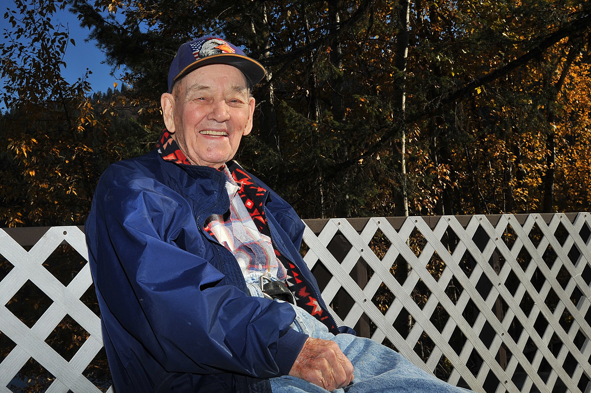 U.S. Air Force retired Maj. Clarence Grimes sits outside his home Oct. 21, 2013, at Marshall Lake Resort in Newport, Wash. Grimes was honored with the French Legion of Honor Medal, the highest recognition by the French government on Oct. 25, at Fairchild Air Force Base, Wash., for his contributions almost 70 years ago to defend and preserve the independence of France. (U.S. Air Force photo by Staff Sgt. Veronica Montes/Released)
