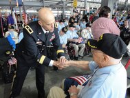 Brig. Gen. Kirk Vollmecke meets with World War II veterans Sept. 27 at the Austin-Bergstrom International Airport prior to the veterans’ departure for Washington, D.C. The commanding general for the Mission and Installation Contracting Command traveled with veterans from Fredericksburg, Texas, to their departure point and spoke briefly to the veterans, thanking them for the significance of their contributions to this nation. The trip for veterans was part of Honor Flight Austin, which transports World War II veterans to Washington to visit memorials dedicated in honor of their service and sacrifices and returns them home through donations. (Army Photo by 1st Lt. Joseph Durlin, courtesy of Mission and Installation Contracting Command Public Affairs)
