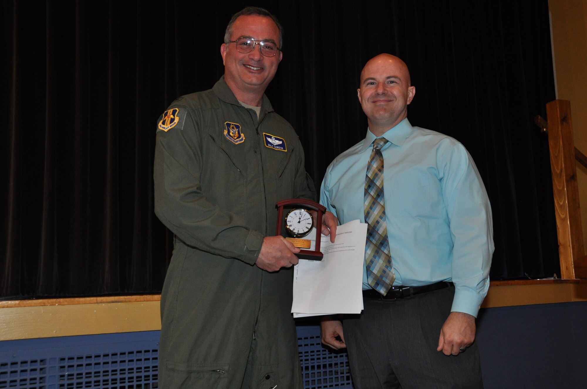 Maj. Eric Schwinge (right), 914th Aeromedical Evacuation Squadron, receives the 914th Airlift Wing Semi-Annual Civilian Award (1st Half - CY 13) in the professional category from Col. Walter Gordon, 914 AW commander, October 21, 2013 at the Niagara Falls Air Reserve Station, N.Y.  (U.S. Air Force photo by Master Sgt. Kevin Nichols)