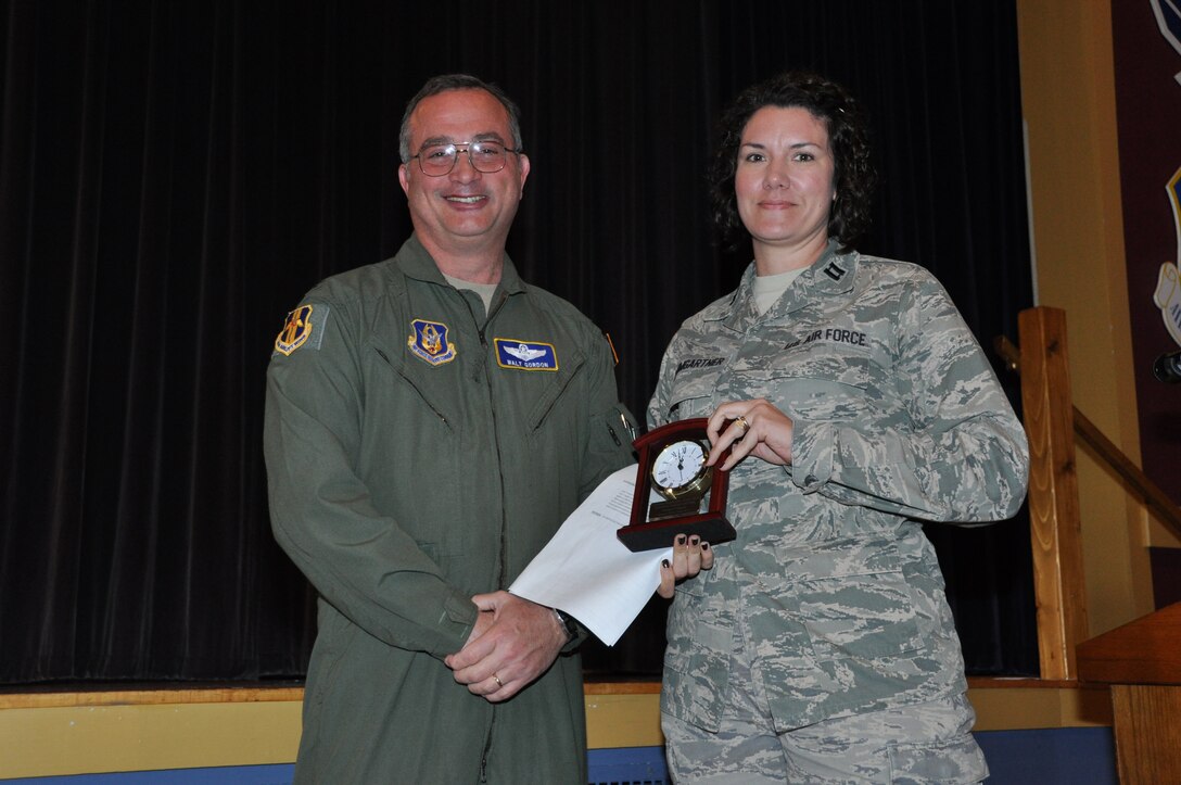Capt. Jennifer Baumgartner, 914th Airlift Wing, receives the 914 AW Semi-Annual Civilian Award (1st Half - CY 13) in the manager category from Col. Walter Gordon, 914 AW commander, October 21, 2013 at the Niagara Falls Air Reserve Station, N.Y.  (U.S. Air Force photo by Master Sgt. Kevin Nichols)