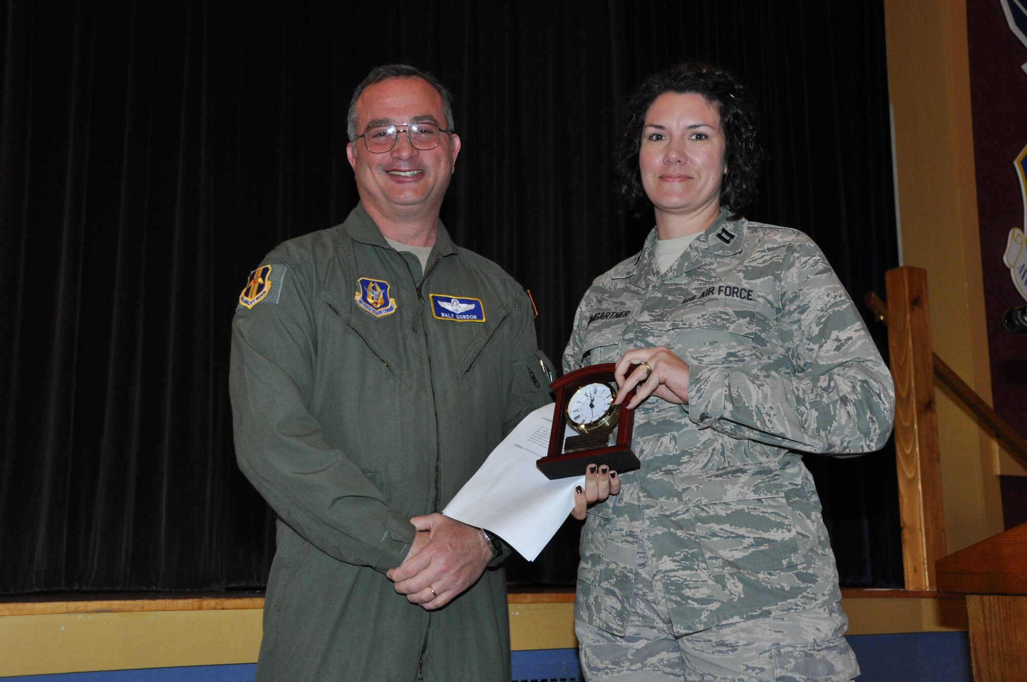 Capt. Jennifer Baumgartner, 914th Airlift Wing, receives the 914 AW Semi-Annual Civilian Award (1st Half - CY 13) in the manager category from Col. Walter Gordon, 914 AW commander, October 21, 2013 at the Niagara Falls Air Reserve Station, N.Y.  (U.S. Air Force photo by Master Sgt. Kevin Nichols)