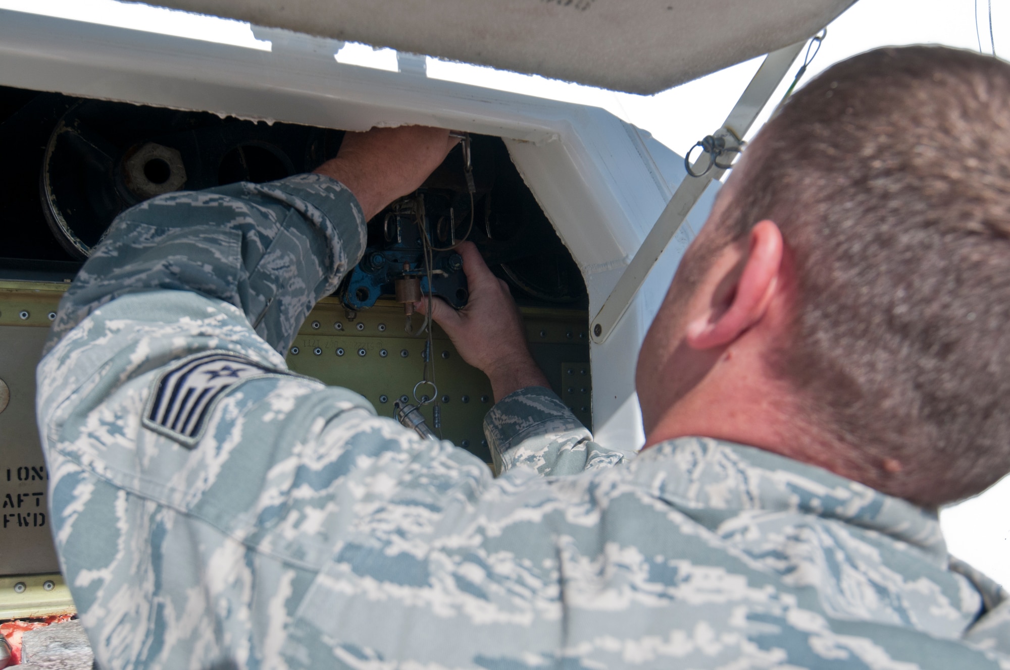 131030-F-BR137-142
Tech. Sgt. Jeffrey Thompson, 90th Missile Maintenance Squadron missile handling technician, attaches a rocket motor carriage to a forklift with first-stage tie-downs during a training scenario in which he and his team took part Oct. 30, 2013, in the Missile handling section controlled area on F.E. Warren Air Force Base, Wyo. (U.S. Air Force photo by Airman 1st Class Jason Wiese)
