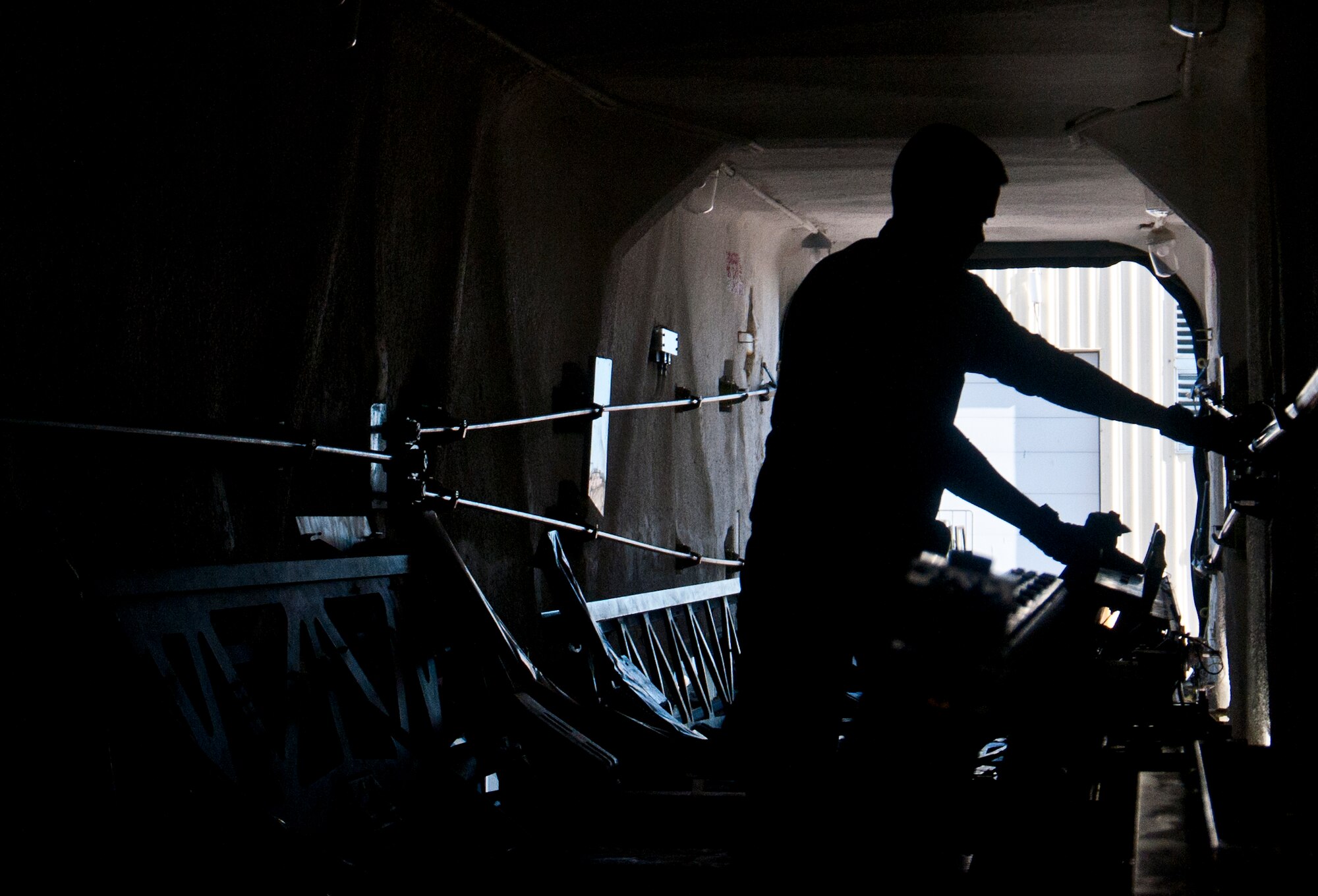 131030-F-BR137-071
Senior Airman Adam Tallman, 90th Missile Maintenance Squadron missile handling technician, prepares rocket motor carriages inside a transport erector for removal via forklift Oct. 30, 2013, in the Missile handling section controlled area on F.E. Warren Air Force Base, Wyo. Tallman’s missile handling team trained to download and upload the carriages from and to a transport erector, which is an operation that is performed in the event of the breakdown of a transport erector in a real-world scenario. (U.S. Air Force photo by Airman 1st Class Jason Wiese)
