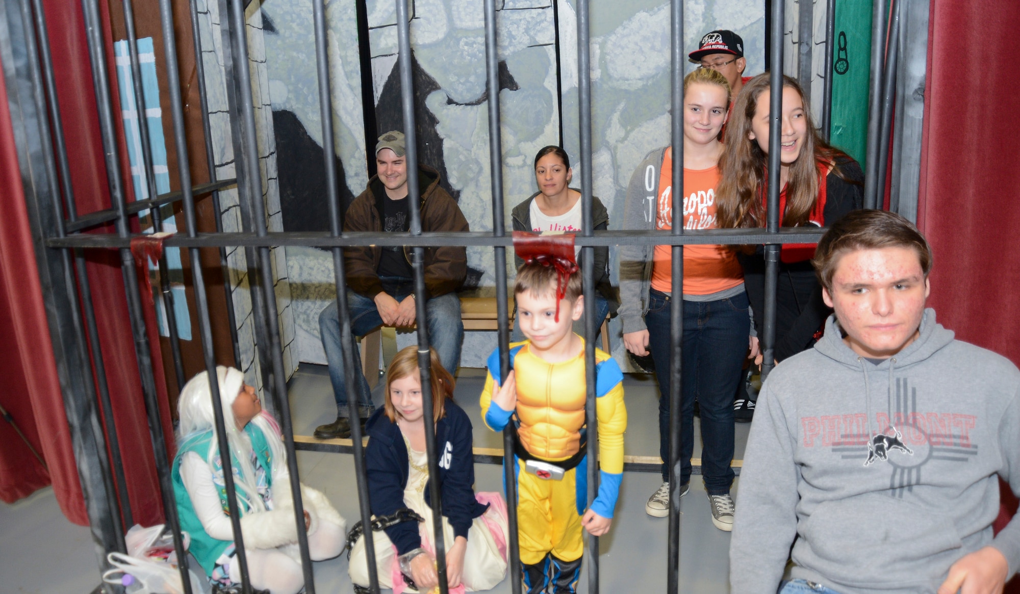 Prisoners are locked away at Royal Air Force Feltwell, England, after their friends paid for their imprisonment during the Haunted Harley Spooktacular at the middle school Oct. 26, 2013. The local Harley Owners Group sponsored the event to promote a drug-free life and raise donations for the Combined Federal Campaign charity drive. (U.S. Air Force photo by Staff Sgt. Thomas Trower/Released)