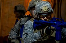 Airmen prepare for close quarter battle glass house drills during the 91st Security Support Squadron tactical response force tryouts at Minot Air Force Base, N.D., Oct. 29. Tryouts help implement the knowledge Airmen are taught from the glass house drills into the shoot house iterations. The training tempo and stress are kept at a high throughout the process. (U.S. Air Force photo/Senior Airman Brittany Y. Auld)