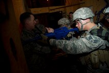 Staff Sgt. William Mack, 91st Security Support Squadron tactical response force member instructs participants on which way to go during the 91st SSPTS TRF tryouts at Minot Air Force Base, N.D., Oct. 29.  The mission of the 91st SSPTS TRF is to respond to hostile attacks anywhere they occur within the 91st Missile Wing Intercontinental Ballistic Missile complex and to use all means necessary to defeat the adversary. (U.S. Air Force photo/Senior Airman Brittany Y. Auld)