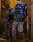 Airmen maneuver through the shoot house in a four-man team during the 91st Security Support Squadron tactical response force tryouts at Minot Air Force Base, N.D., Oct. 29.  The 91st SSPTS TRF tryouts are structured to test Airmen physical and mental ability during high pressure situations. (U.S. Air Force photo/Senior Airman Brittany Y. Auld)
