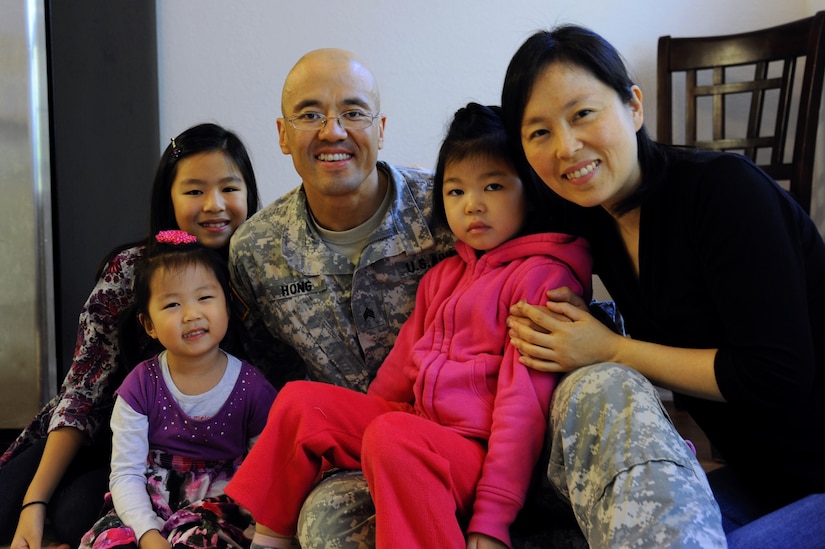 From left, Mary, Grace, David, Sophia and Monica Hong pose for a photo in their home at Fort Eustis, Va., Oct. 21, 2013. Sophia has Dravet Syndrome, a rare form of intractable epilepsy in infants who possess a gene mutation, causing severe seizures and slower development. (U.S. Air Force photo by Airman 1st Class Austin Harvill/Released)