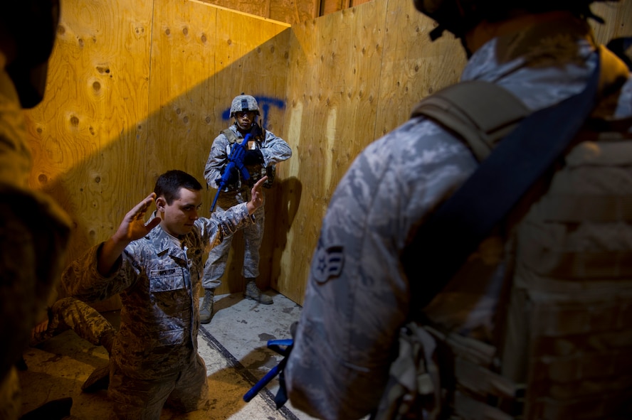 Senior Airman Arthur Moody, 91st Missile Security Forces member performs close quarter battle glass house drills during the 91st Security Support Squadron tactical response force tryouts at Minot Air Force Base, N.D., Oct. 29. TRF tryout process can last anywhere from six to eight hours. (U.S. Air Force photo/Senior Airman Brittany Y. Auld)