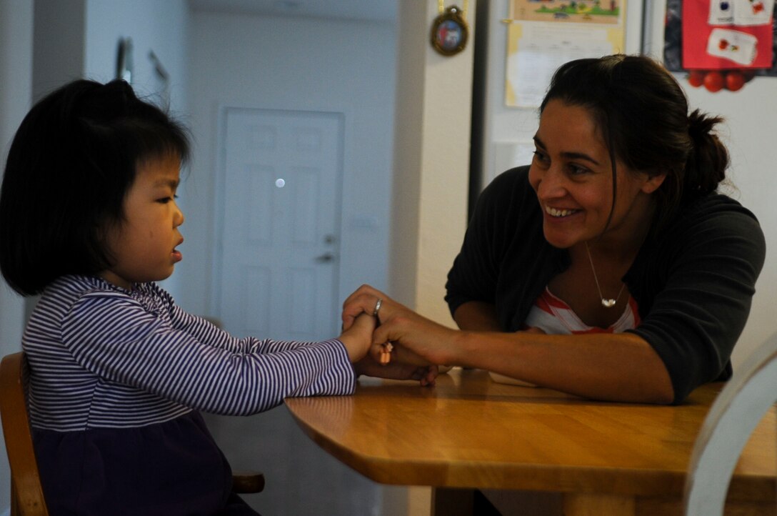 Alona Luckey, an Applied Behavioral Analysis tutor, works with Sophia, 5-year-old daughter of U.S. Army Sgt. David Hong, Fort Eustis chaplain assistant, on developmental skills at Fort Eustis, Va., Oct. 7, 2013. Because of Dravet syndrome, a rare form of epilepsy caused by gene mutations, Sophia has developed slower than her peers. (U.S. Air Force photo by Airman 1st Class Austin Harvill/Released)