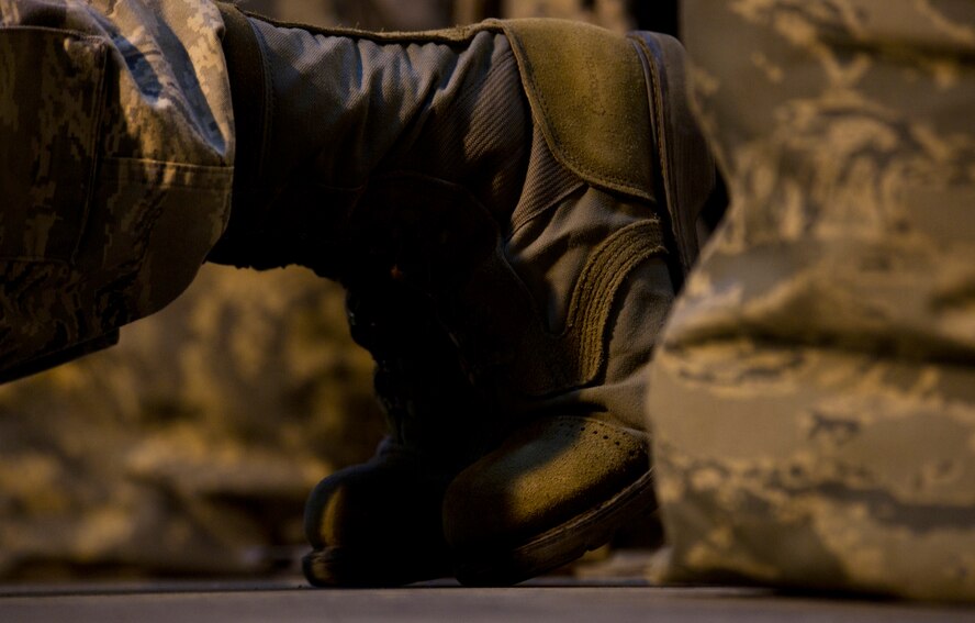 Senior Airman Arthur Moody, 91st Missile Security Forces member performs push-ups during the 91st Security Support Squadron tactical response force tryouts at Minot Air Force Base, N.D., Oct. 29. During tryouts, Airmen are expected to implement the knowledge they are taught from the glass house drills into the shoot house iterations. The training tempo and stress are kept at a high throughout the process. (U.S. Air Force photo/Senior Airman Brittany Y. Auld)