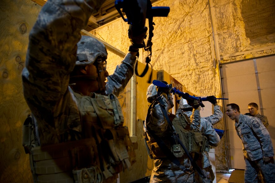 Master Sgt. Joseph Anderson, 91st Security Support Squadron tactical response force superintendent distracts participants during the TRF tryouts at Minot Air Force Base, N.D., Oct. 29. The Tactical Response Force is a nuclear special weapons and tactics team specializing in recapture and recovery operations. (U.S. Air Force photo/Senior Airman Brittany Y. Auld)
