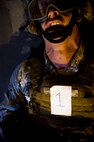 Senior Airman Derrick Besser, 791st Missile Security Forces member rest after lifting a log during the 91st Security Support Squadron tactical response force tryouts at Minot Air Force Base, N.D., Oct. 29.  The Tactical Response Force is a nuclear special weapons and tactics team specializing in recapture and recovery operations. (U.S. Air Force photo/Senior Airman Brittany Y. Auld)