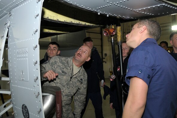 131030-Z-VF226-025 – Master Sgt. Charles Snyder, 127th Maintenance Squadron, provides a familiarization overview of A-10 Thunderbolt II systems to aircraft maintenance technicians from Coast Guard Air Station Detroit at Selfridge Air National Guard Base, Oct. 30, 2013. The 127th MXS maintains A-10 Thunderbolt II attack fighters and Air Station Detroit operates MH-65 Dolphin rescue helicopters at Selfridge. The Coast Guard personnel at Air Station Detroit do not normally have the opportunity to work on aircraft with cockpit pressurization systems and contacted the 127th MXS for joint training. (Air National Guard photo by Brittani Baisden / Released)